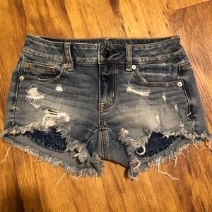 American Eagle “shortie” distressed shorts